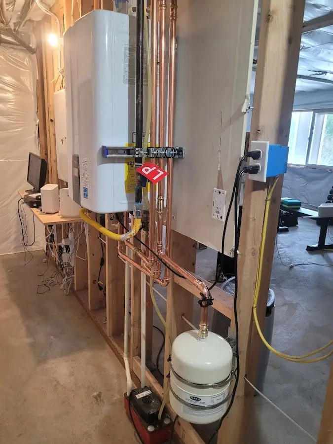 Licensed plumber repairing a kitchen sink in Waterville